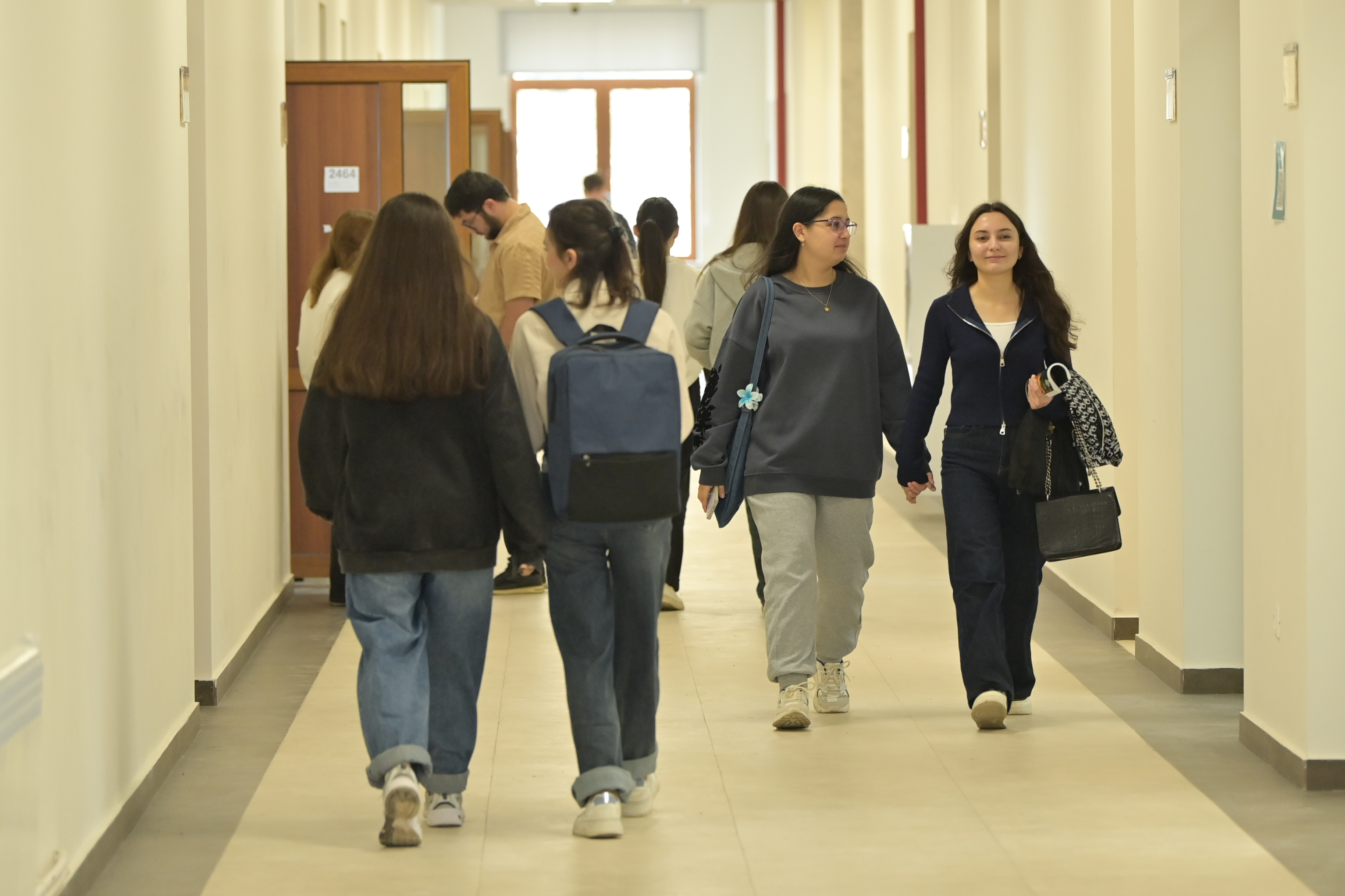 Students walking in the corridor of the KU main building