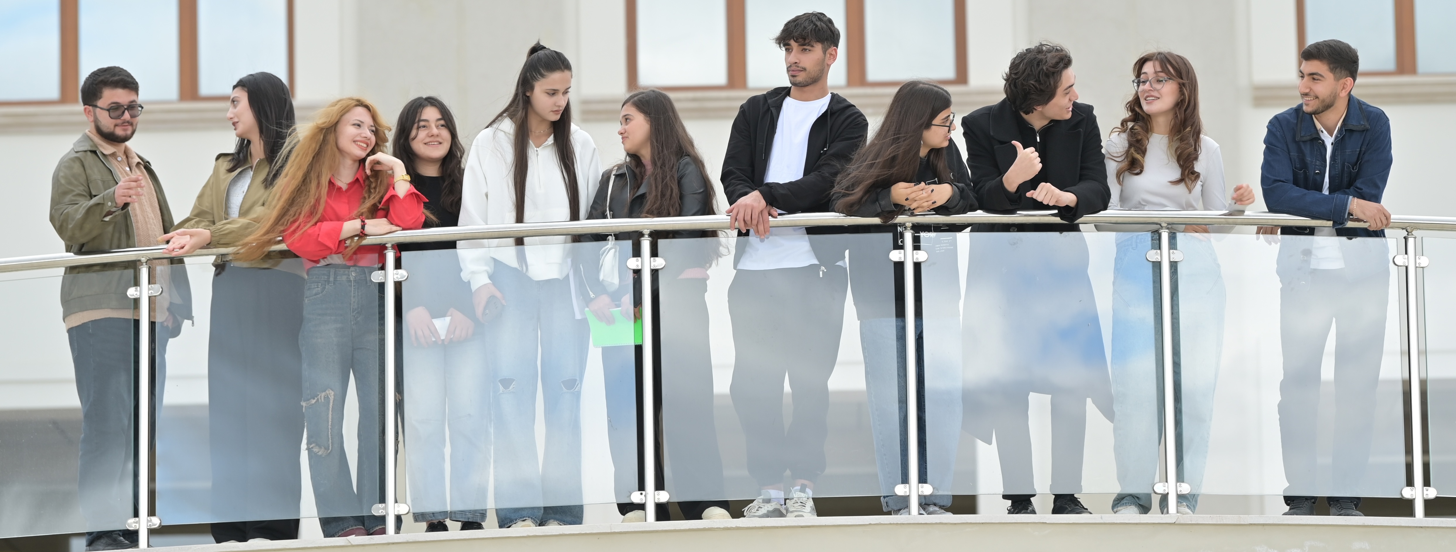 Students in the balcony main building