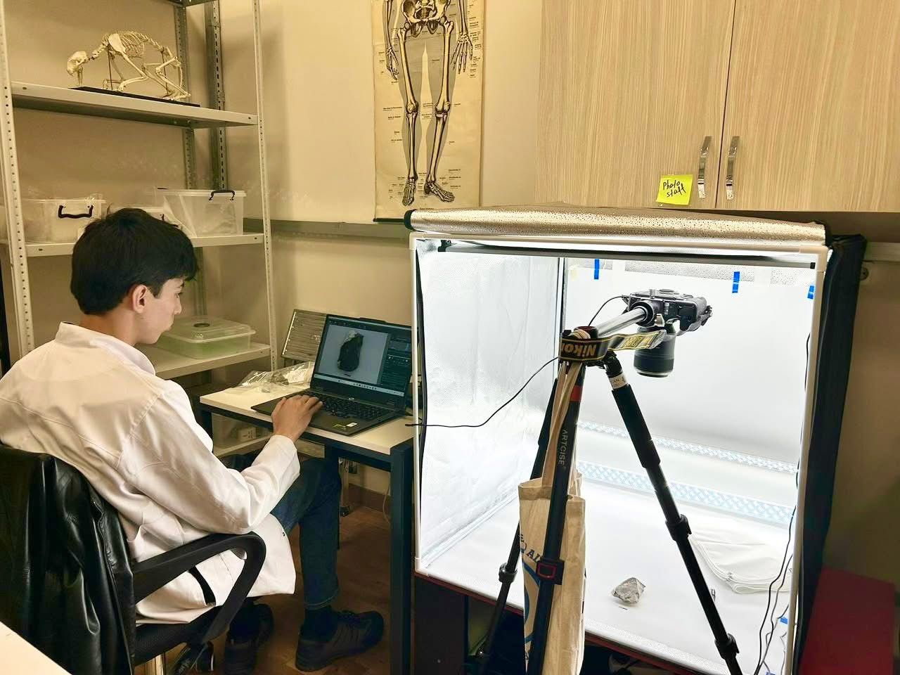 Azykh lab student analyzing an artifact