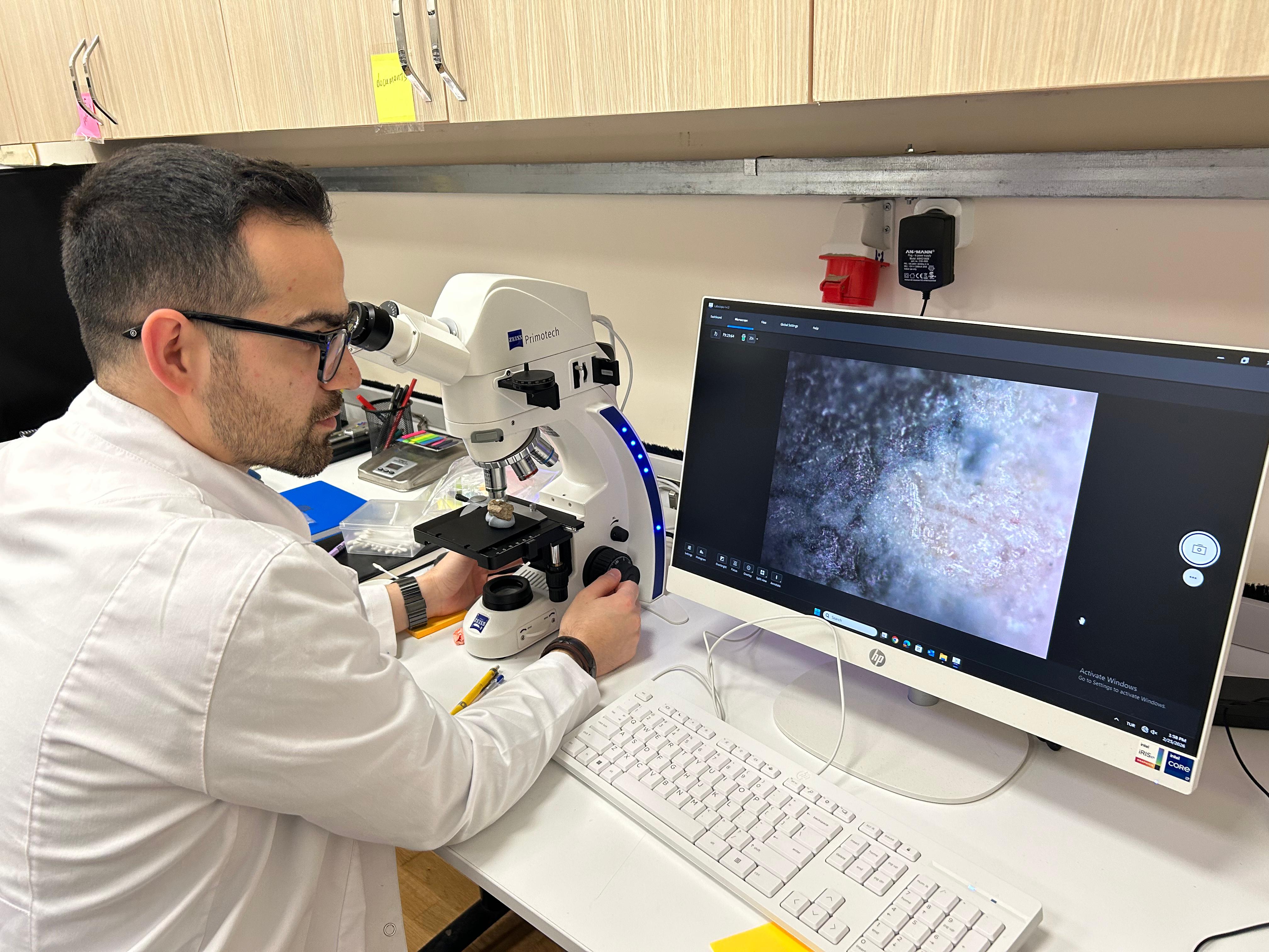 Azykh lab a researcher analyzing an artifact
