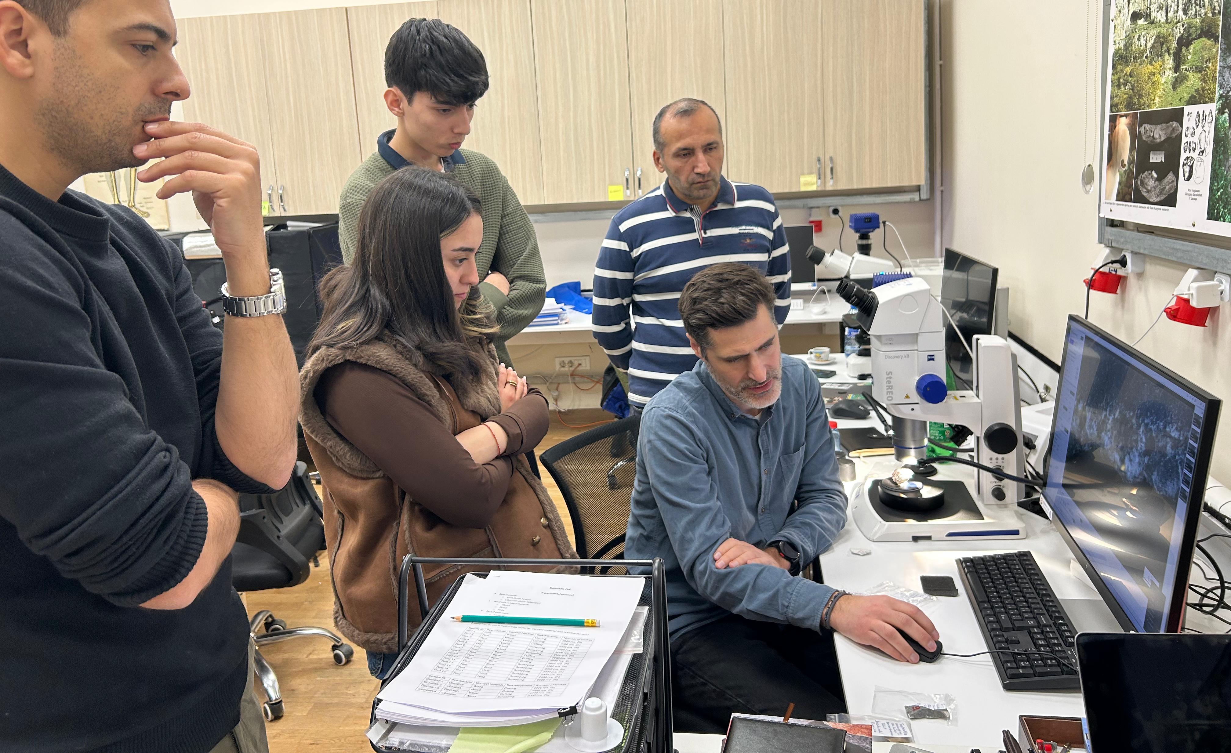 Azykh lab researchers and the team discussing findings